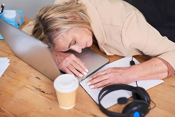 Person working at a desk feeling afternoon fatigue